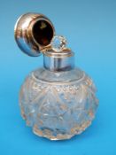 A hallmarked silver mounted and inlaid tortoiseshell cut glass scent bottle