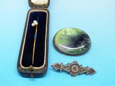 A yellow metal stick pin with three pearls surrounding a diamond (in original box),