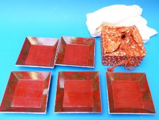 Four signed mother of pearl Japanese lacquer dishes and a Japanese handbag,