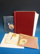 Two albums of stamps and a commemorative £5 coin etc