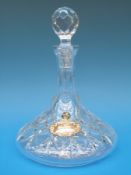 A Stephens crystal ship's decanter with hallmarked silver label,