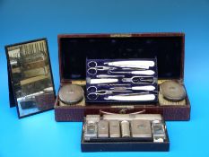 An Asprey travelling dressing table set in crocodile case,