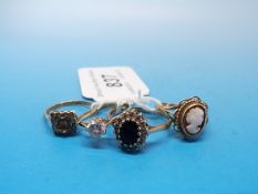 Four 9ct gold rings, one set with a cameo,