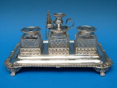 A Georgian hallmarked silver desk stand with three cut glass inkwells,