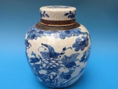 A large 19thC covered Chinese blue and white crackle glazed ginger jar (24.