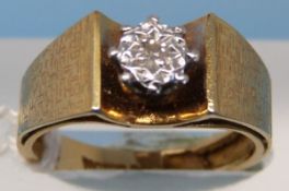 An 18ct gold ring set with a diamond in an illusion setting (size K)