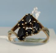 A 9ct gold ring set with three oval and two circular sapphires (size K)