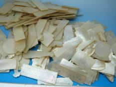 A quantity of Chinese mother of pearl gaming counters including fish (approx 180 in total)