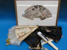 A collection of Chinese and Japanese fans, some with ivory ends, one with hand-painted decoration,