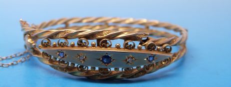 A 9ct gold bracelet set with sapphires and diamonds