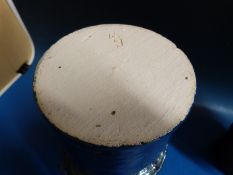 Two ceramic vases in the form of totem poles with multiple faces