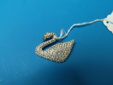 A Swarovski swan brooch
