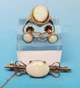 A yellow metal ring marked 9ct gold set with an oval opal,