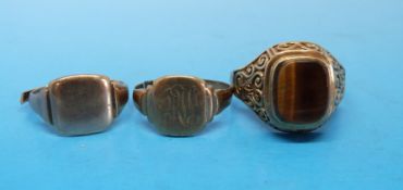 A 9ct gold ring set with tigers eye together with two 9ct gold signet rings (12g)