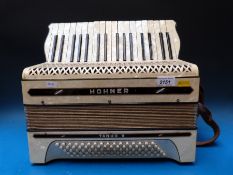 A Hohner 'Tango II' c1930s 80 bass piano accordion in ivory pearloid finish (in case)