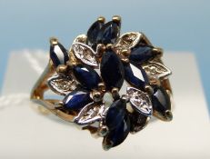 A 9ct gold ring set with sapphires and diamonds in a cluster (size K)