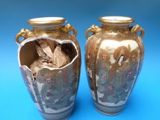 A pair of  19thC Japanese Satsuma vases decorated with immortals (25cm tall)