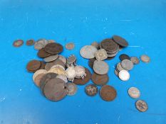 A collection of coins to include a coin bracelet