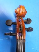 Two cased violins and bows, one by P&H of London (length of backs 315cm and 34.