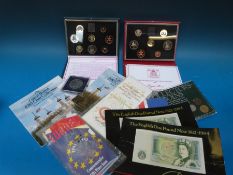 A collection of proof and collector's coin sets including cased examples, modern crowns,