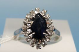 WITHDRAWN 
An 18ct gold ring set with a central sapphire,