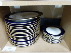 A quantity of blue & gilt dinnerware to include dinner plates, bowls, serving dishes,
