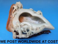 A Chinese jadeite brush washer in the shape of a peach carved in relief with scrolling chilong,