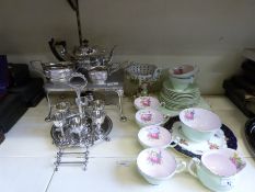 An egg set on stand, plated tea set, hotplate with spirit burner,