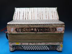 A Casali Verona 36 bass Italian piano accordion in pink onyx finish with matching stamps to