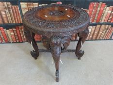 A late 19thC Indian carved side table,
