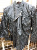 A Victorian ladies' costume consisting of skirt with underskirt together with a fitted jacket