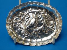 A Victorian hallmarked silver pin dish with embossed owl in foliage (Ldn 1886) maker John