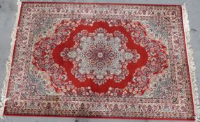 A rug with floral pattern on a red ground (L295 x W201cm)