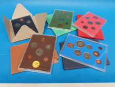 Five Royal MInt UK coin sets in perspex cases 1972-1976 examples