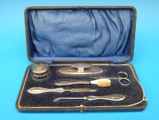 A cased hallmarked silver manicure set