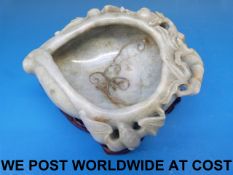 A Chinese jadeite brush washer in the shape of a peach carved in relief with bats and clouds,
