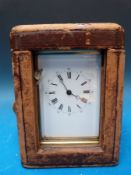 A late 19th/ early 20th century carriage clock in gilded brass Corniche style case,