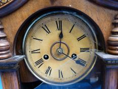 A Junghans shelf clock in carved wooden case