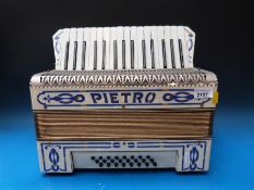 A Pietro 24 bass piano accordion,