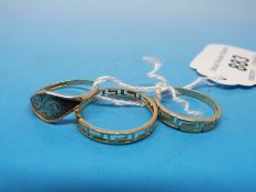 A 9ct gold ring together with two other yellow metal rings,