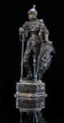 A German white metal and ivory figure by Berthold Hermann Muller of Hanau in the form of a knight