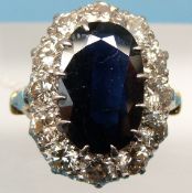 An 18ct gold ring set with a large oval cut sapphire measuring 3.