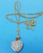 A 9ct gold and diamond heart pendant and chain