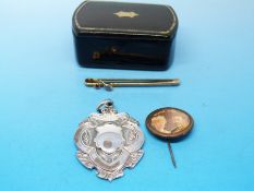 A 9ct gold brooch with small aquamarine and garnet decoration together with a hallmarked silver fob
