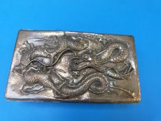 A Japanese white metal jewellery casket with heavily embossed dragon to lid,