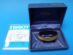 A boxed 9ct gold ladies Tissot watch marked 375 to strap