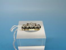 A 18ct gold ring set with five round brilliant cut diamonds (total diamond weight approx 0.