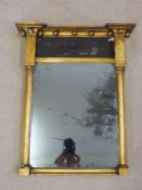 A Regency gilt mirror with balls to frieze,