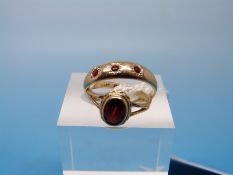 Two hallmarked 9ct gold rings set with garnets