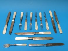 A quantity of mother of pearl handled and other cutlery to include some hallmarked silver examples